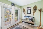 The tiled Mudroom is the perfect place to leave coats, boots and shoes